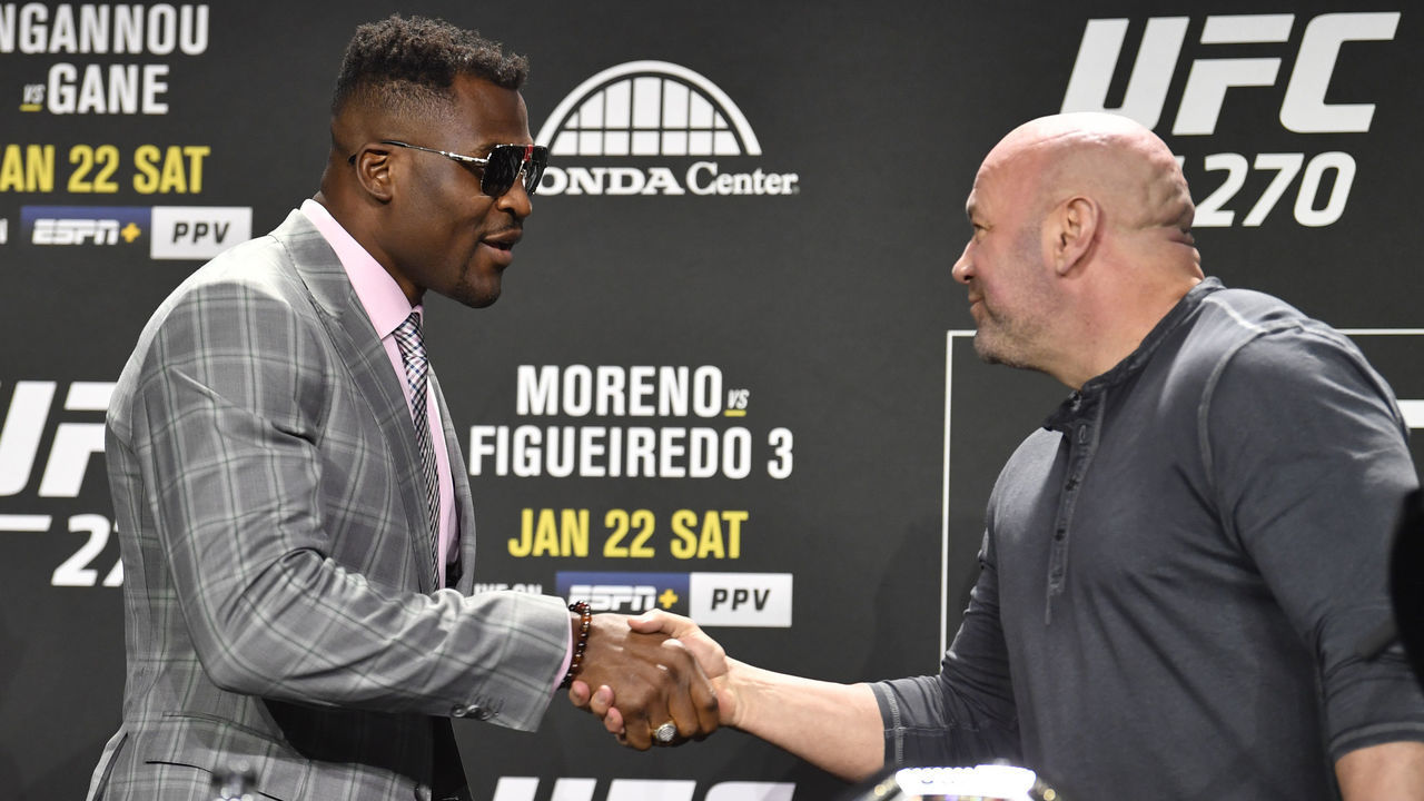 ANAHEIM, CALIFORNIA - JANUARY 20: Francis Ngannou of Cameroon shakes hands with UFC president Dana White during the UFC 270 press conference at the Anaheim Convention Center on January 20, 2022 in Anaheim, California.