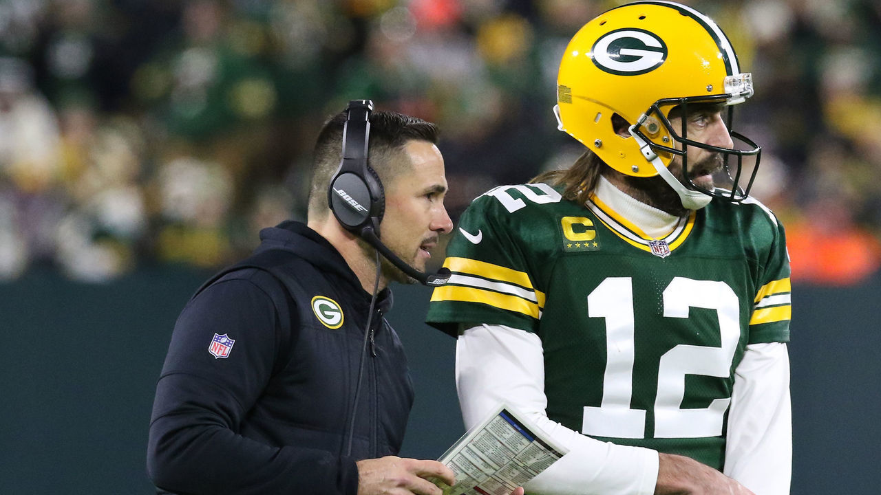 GREEN BAY, WI - NOVEMBER 28: Green Bay Packers quarterback Aaron Rodgers (12) and Green Bay Packers head coach Matt LaFleur talk during a time out during a game between the Green Bay Packers and the Los Angeles Rams at Lambeau Field on November 28, 2021 in Green Bay, WI.