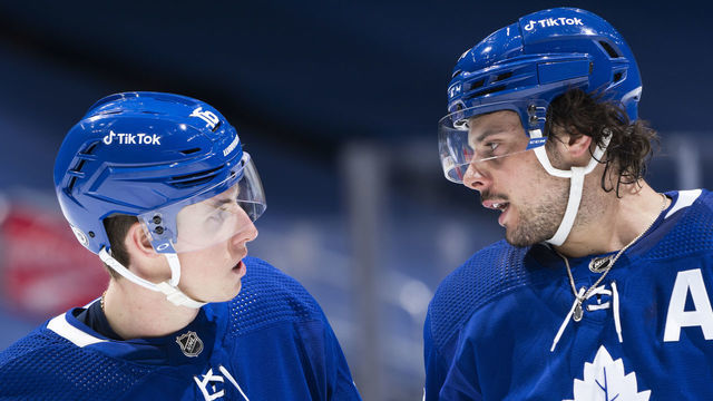 TORONTO, ON - JANUARY 5: Auston Matthews #34 and Mitchell Marner #16 of the Toronto Maple Leafs speak in a break against the Edmonton Oilers during the first period at the Scotiabank Arena on January 5, 2022 in Toronto, Ontario, Canada.