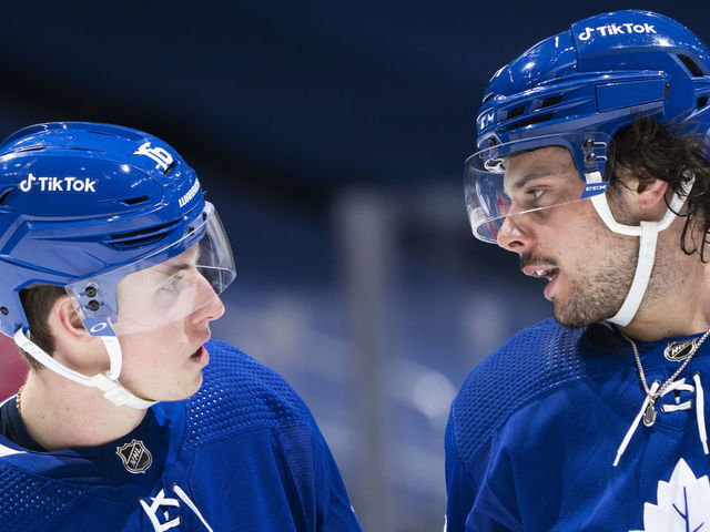 TORONTO, ON - JANUARY 5: Auston Matthews #34 and Mitchell Marner #16 of the Toronto Maple Leafs speak in a break against the Edmonton Oilers during the first period at the Scotiabank Arena on January 5, 2022 in Toronto, Ontario, Canada.
