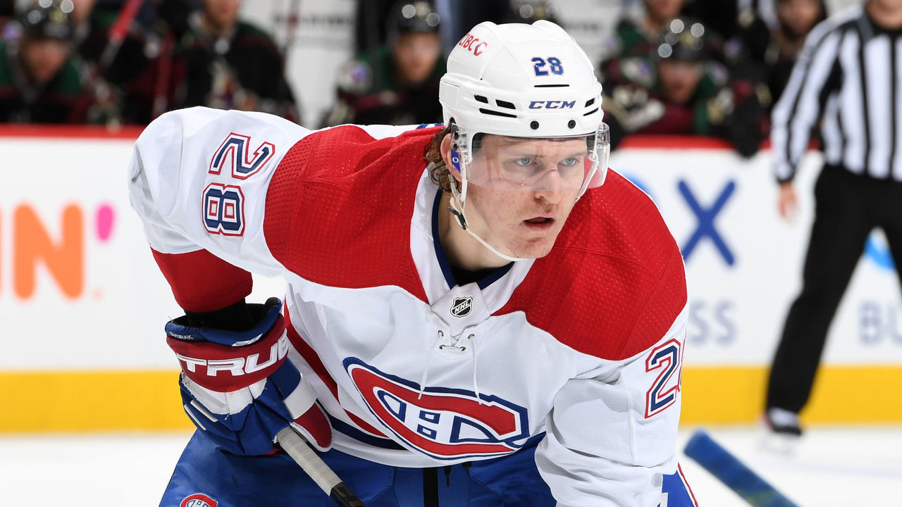 GLENDALE, ARIZONA - JANUARY 17: Christian Dvorak #28 of the Montreal Canadiens gets ready during a face off against the Arizona Coyotes at Gila River Arena on January 17, 2022 in Glendale, Arizona.