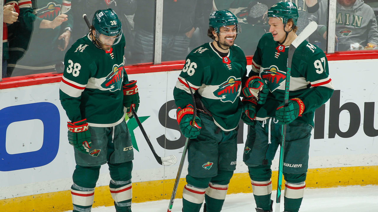 SAINT PAUL, MN - JANUARY 24: Mats Zuccarello #36 celebrates his goal with teammates Ryan Hartman #38 and Kirill Kaprizov #97 of the Minnesota Wild against the Montreal Canadiens during the game at the Xcel Energy Center on January 24, 2022 in Saint Paul, Minnesota.
