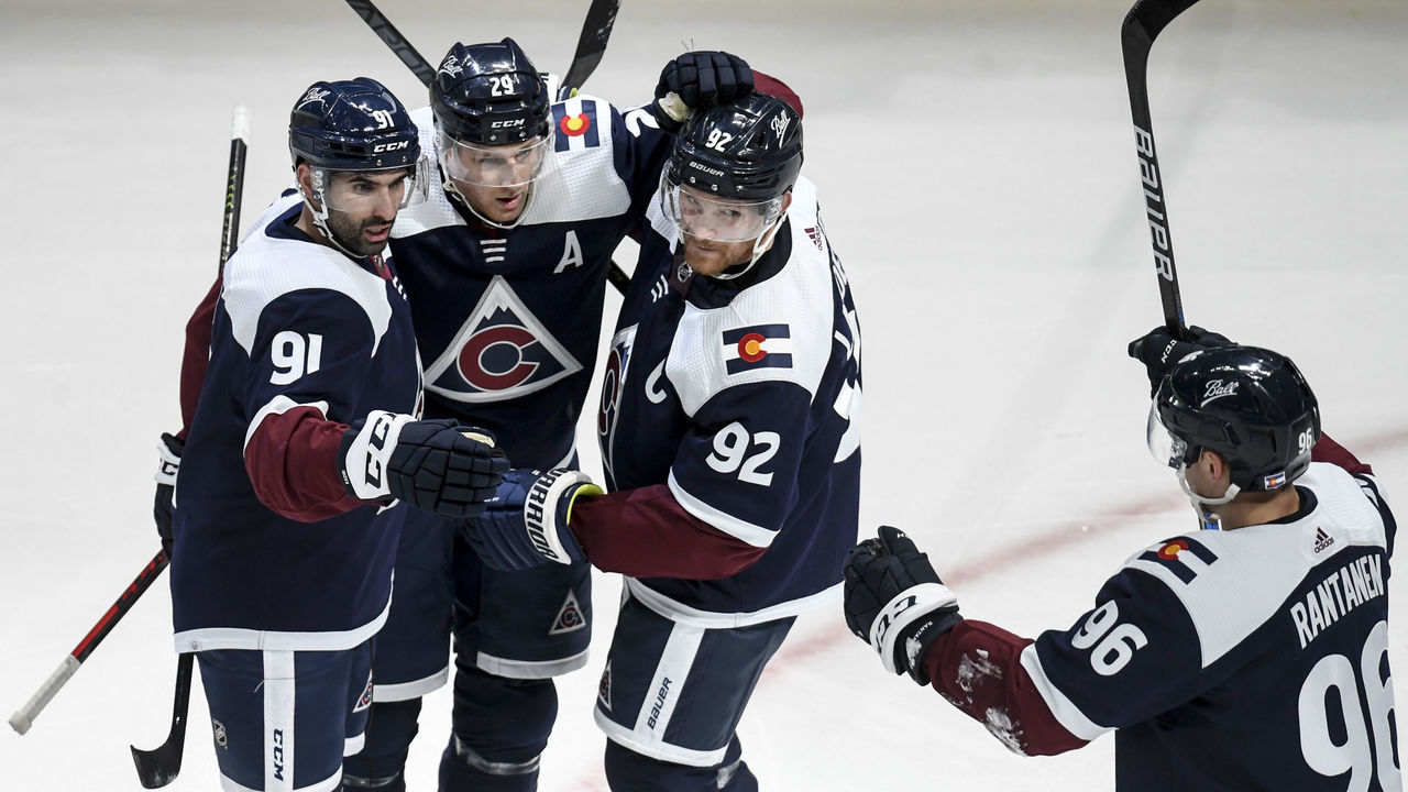 DENVER, CO - JANUARY 24: Nazem Kadri (91) of the Colorado Avalanche celebrates his 1-0 goal with teammates Nathan MacKinnon (29), Gabriel Landeskog (92) and Mikko Rantanen (96) during the second period against the Chicago Blackhawks on Monday, January 24, 2022.
