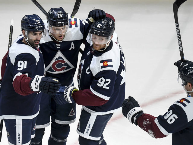 DENVER, CO - JANUARY 24: Nazem Kadri (91) of the Colorado Avalanche celebrates his 1-0 goal with teammates Nathan MacKinnon (29), Gabriel Landeskog (92) and Mikko Rantanen (96) during the second period against the Chicago Blackhawks on Monday, January 24, 2022.