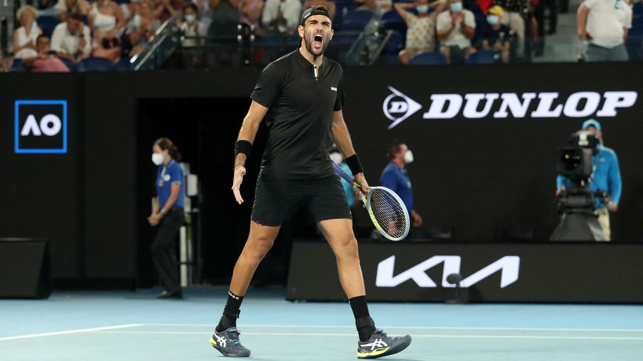 Italy's Matteo Berrettini celebrates after beating France's Gael Monfils in their men's singles quarter-final match at the Australian Open tennis tournament in Melbourne on January 26, 2022. - -- IMAGE RESTRICTED TO EDITORIAL USE - STRICTLY NO COMMERCIAL USE --