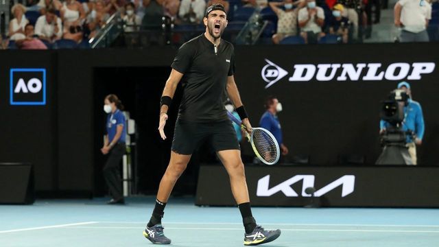 Italy's Matteo Berrettini celebrates after beating France's Gael Monfils in their men's singles quarter-final match at the Australian Open tennis tournament in Melbourne on January 26, 2022. - -- IMAGE RESTRICTED TO EDITORIAL USE - STRICTLY NO COMMERCIAL USE --