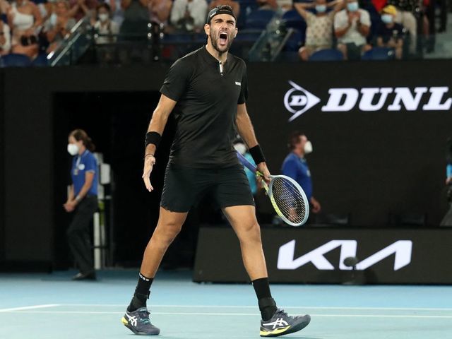 Italy's Matteo Berrettini celebrates after beating France's Gael Monfils in their men's singles quarter-final match at the Australian Open tennis tournament in Melbourne on January 26, 2022. - -- IMAGE RESTRICTED TO EDITORIAL USE - STRICTLY NO COMMERCIAL USE --