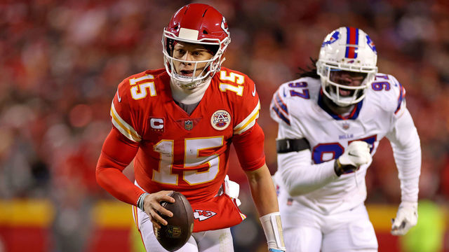 KANSAS CITY, MISSOURI - JANUARY 23: Patrick Mahomes #15 of the Kansas City Chiefs runs the ball for an 8 yard touchdown against the Buffalo Bills during the first quarter in the AFC Divisional Playoff game at Arrowhead Stadium on January 23, 2022 in Kansas City, Missouri.