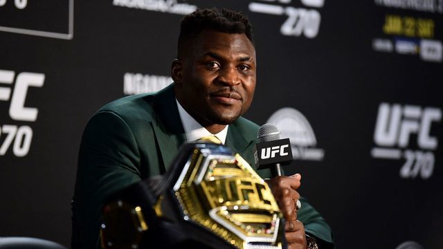 Champion Cameroon's Francis Ngannou takes questions in the press room after defeating French Cyril Gane in their UFC 270 championship fight in Anaheim on January 22, 2022.