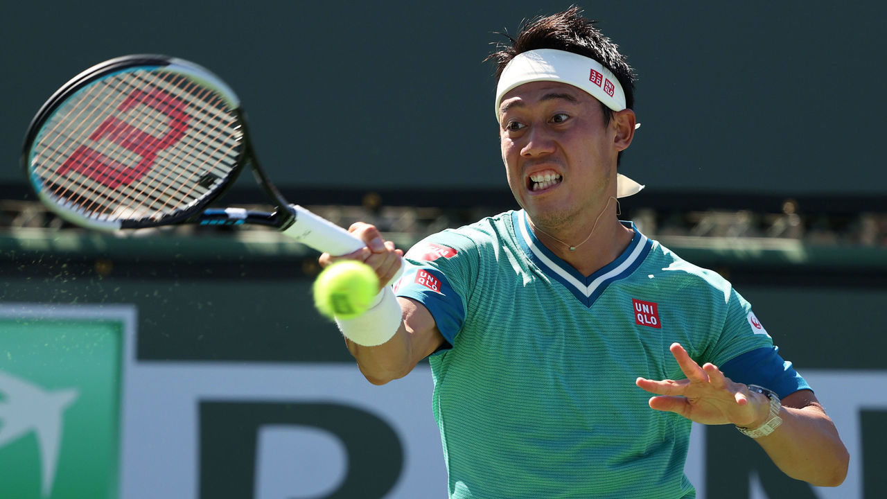 INDIAN WELLS, CALIFORNIA - OCTOBER 09: Kei Nishikori of Japan plays a forehand against Dan Evans of Great Britain during their second round match on Day 6 of the BNP Paribas Open at the Indian Wells Tennis Garden on October 09, 2021 in Indian Wells, California.