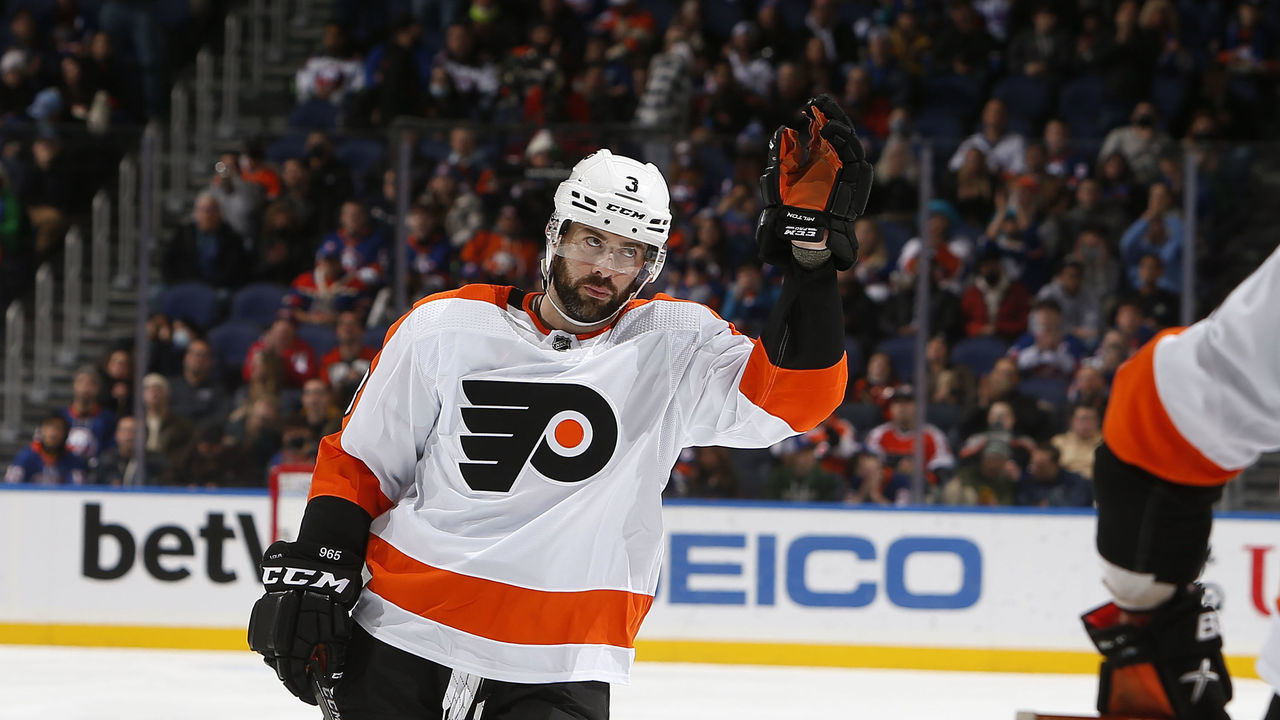 ELMONT, NY - JANUARY 25: Keith Yandle #3 of the Philadelphia Flyers acknowledges the crowd after it is announce he has set a new NHL record for his his 965th consecutive start against the New York Islanders on January 25, 2022 at the UBS Arena in Elmont, New York.