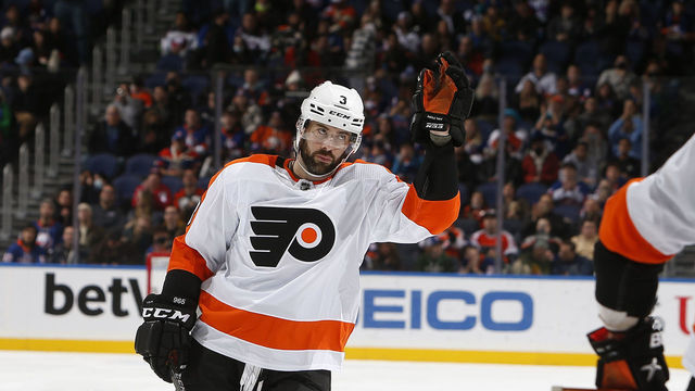 ELMONT, NY - JANUARY 25: Keith Yandle #3 of the Philadelphia Flyers acknowledges the crowd after it is announce he has set a new NHL record for his his 965th consecutive start against the New York Islanders on January 25, 2022 at the UBS Arena in Elmont, New York.