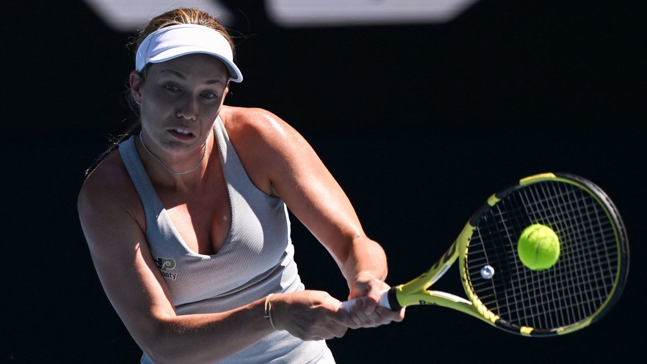 Danielle Collins of the US hits a return against France's Alize Cornet during their women's singles quarter-final match on day ten of the Australian Open tennis tournament in Melbourne on January 26, 2022. - -- IMAGE RESTRICTED TO EDITORIAL USE - STRICTLY NO COMMERCIAL USE --