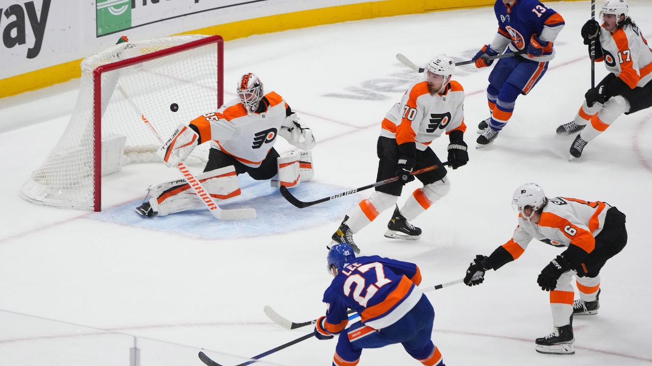 ELMONT, NY - JANUARY 25: New York Islanders Center Anders Lee (27) scores a goal on Philadelphia Flyers Goalie Martin Jones (35) during the first period of the National Hockey League game between the Philadelphia Flyers and the New York Islanders on January 25, 2022, at UBS Arena in Elmont, NY.