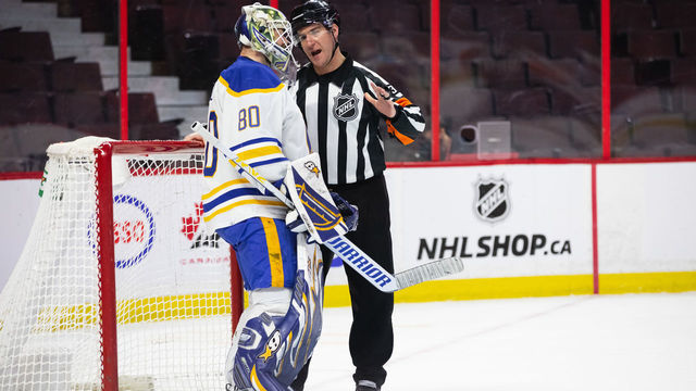 OTTAWA, ON - JANUARY 25: Referee Pierre Lambert (37) talks to Buffalo Sabres Goalie Aaron Dell (80) after a whistle during second period National Hockey League action between the Buffalo Sabres and Ottawa Senators on January 25, 2022, at Canadian Tire Centre in Ottawa, ON, Canada.