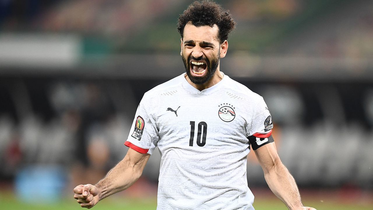Egypt's forward Mohamed Salah celebrates after winning the Africa Cup of Nations (CAN) 2021 round of 16 football match between Ivory Coast and Egypt at Stade de Japoma in Douala on January 26, 2022.