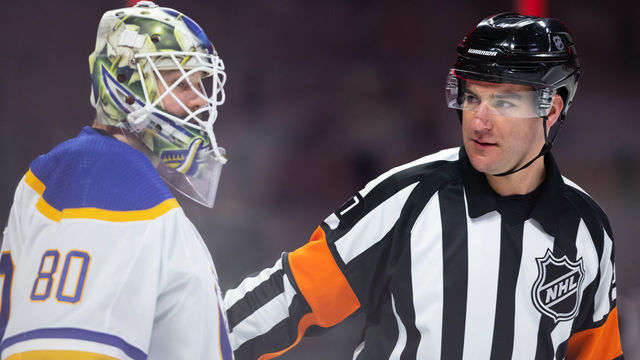 OTTAWA, ON - JANUARY 25: Referee Pierre Lambert (37) talks to Buffalo Sabres Goalie Aaron Dell (80) after a whistle during second period National Hockey League action between the Buffalo Sabres and Ottawa Senators on January 25, 2022, at Canadian Tire Centre in Ottawa, ON, Canada.