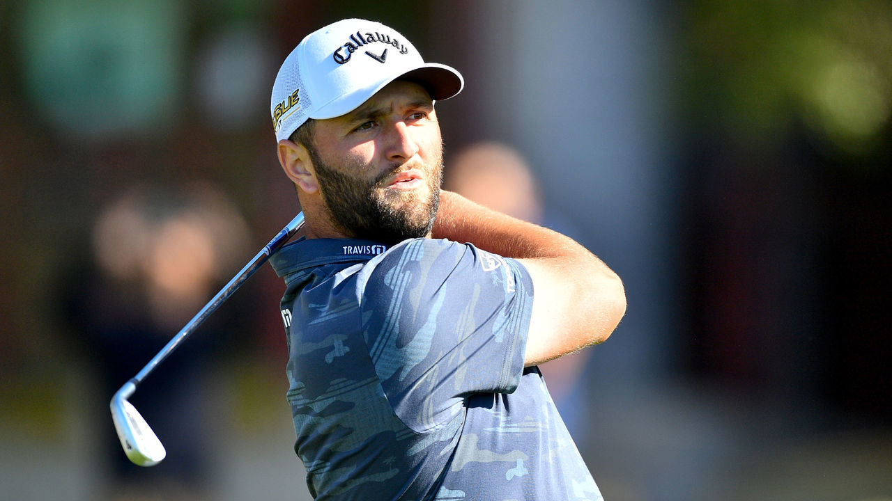 SAN DIEGO, CA - JANUARY 26: Jon Rahm hits off the tee on the 11th hole on the South Course during the first round of the Farmers Insurance Open golf tournament at Torrey Pines Municipal Golf Course on January 26, 2022.