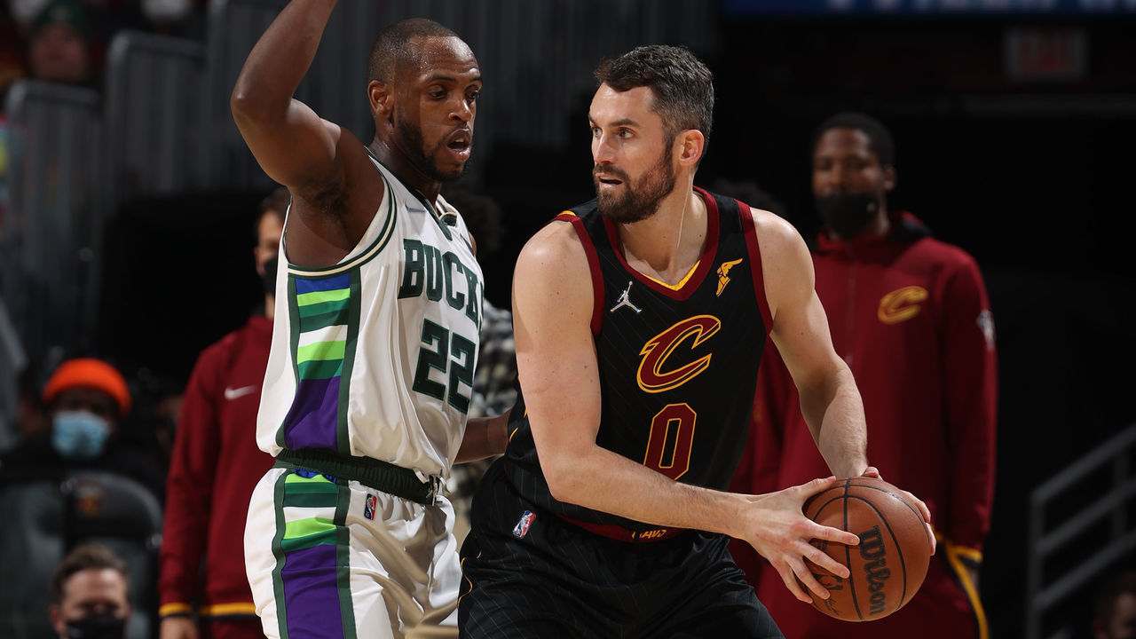 CLEVELAND, OH - JANUARY 26: Khris Middleton #22 of the Milwaukee Bucks plays defense on Kevin Love #0 of the Cleveland Cavaliers during the game on January 26, 2022 at Rocket Mortgage FieldHouse in Cleveland, Ohio. NOTE TO USER: User expressly acknowledges and agrees that, by downloading and/or using this Photograph, user is consenting to the terms and conditions of the Getty Images License Agreement. Mandatory Copyright Notice: Copyright 2022 NBAE