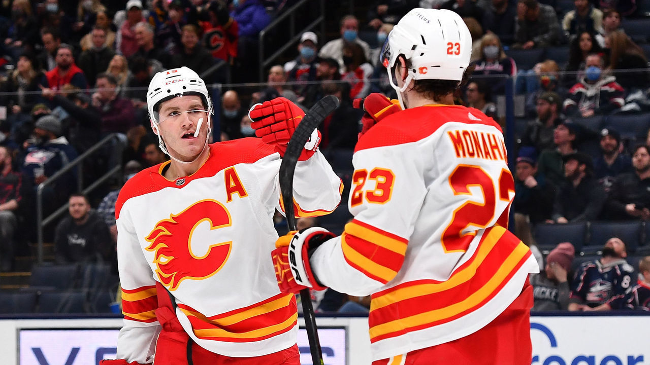 COLUMBUS, OH - JANUARY 26: Matthew Tkachuk #19 celebrates his goal with Sean Monahan #23 of the Calgary Flames during the second period against the Columbus Blue Jackets at Nationwide Arena on January 26, 2022 in Columbus, Ohio.