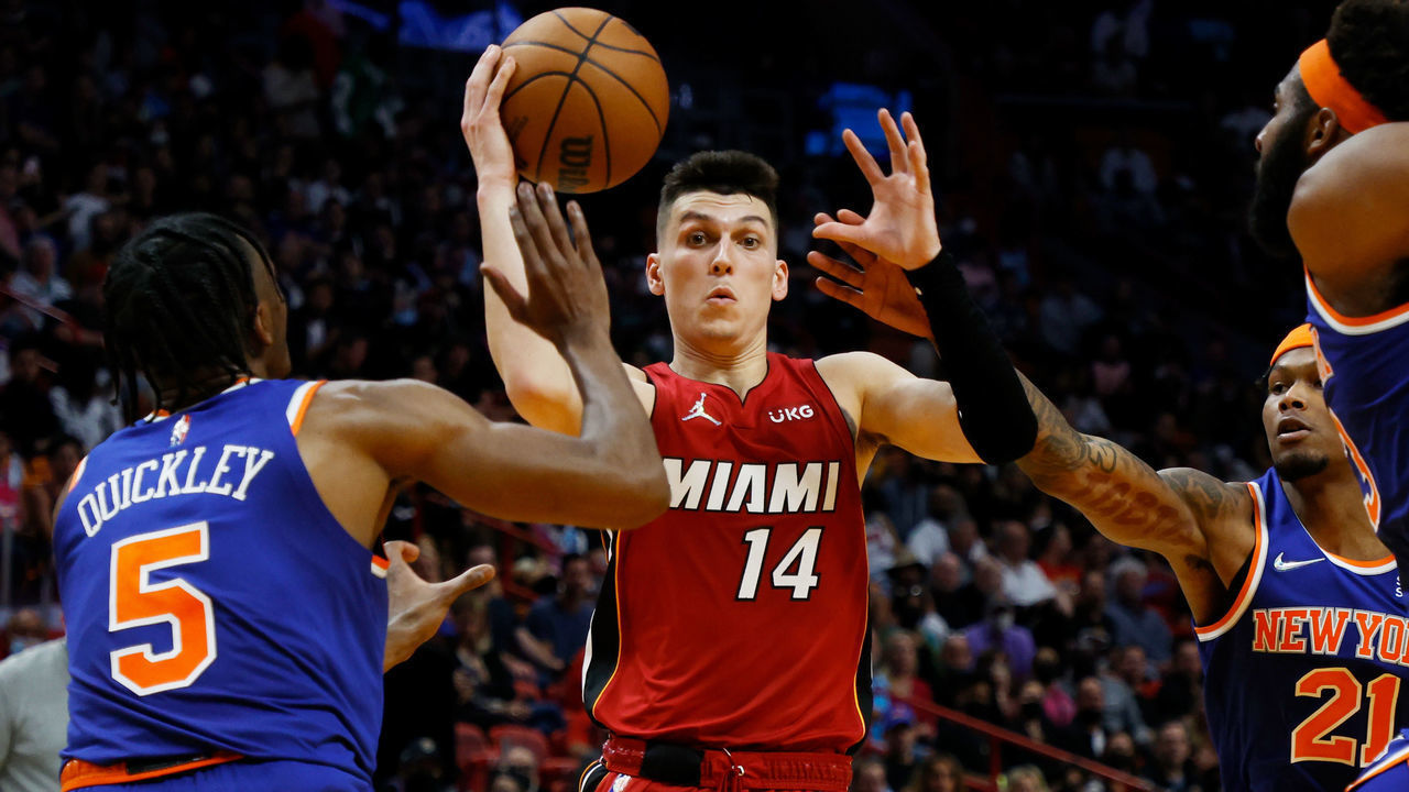 MIAMI, FLORIDA - JANUARY 26: Tyler Herro #14 of the Miami Heat and Immanuel Quickley #5 of the New York Knicks vie for possession in the second half at FTX Arena on January 26, 2022 in Miami, Florida.