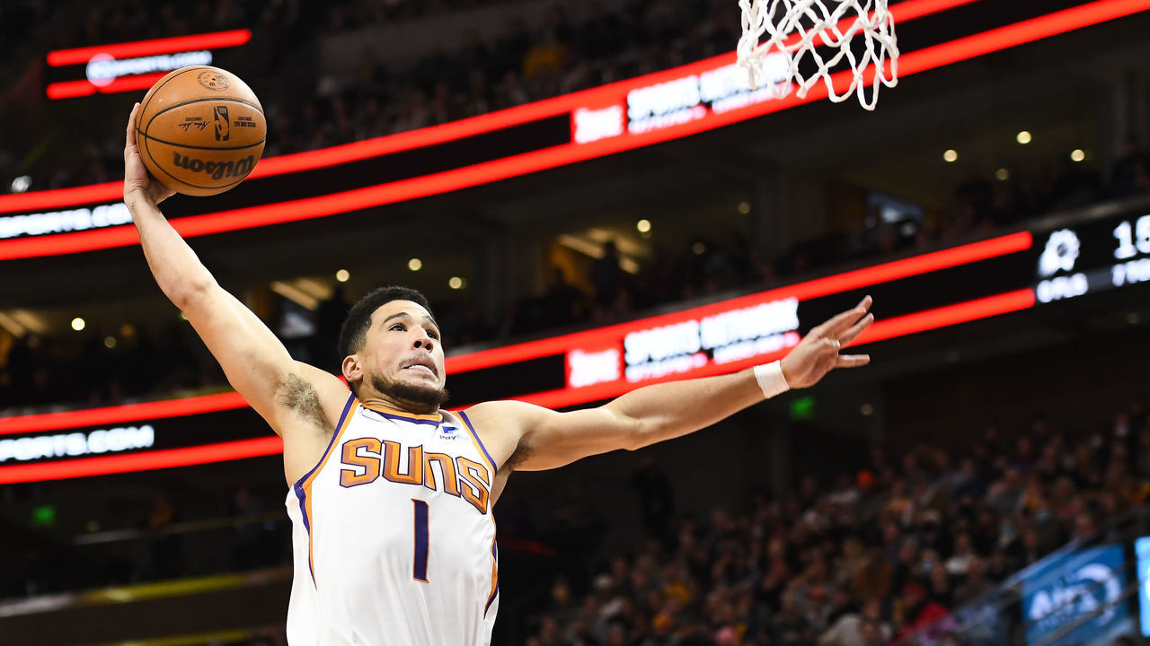 SALT LAKE CITY, UTAH - JANUARY 26: Devin Booker #1 of the Phoenix Suns dunks during the first half of a game against the Utah Jazz at Vivint Smart Home Arena on January 26, 2022 in Salt Lake City, Utah.