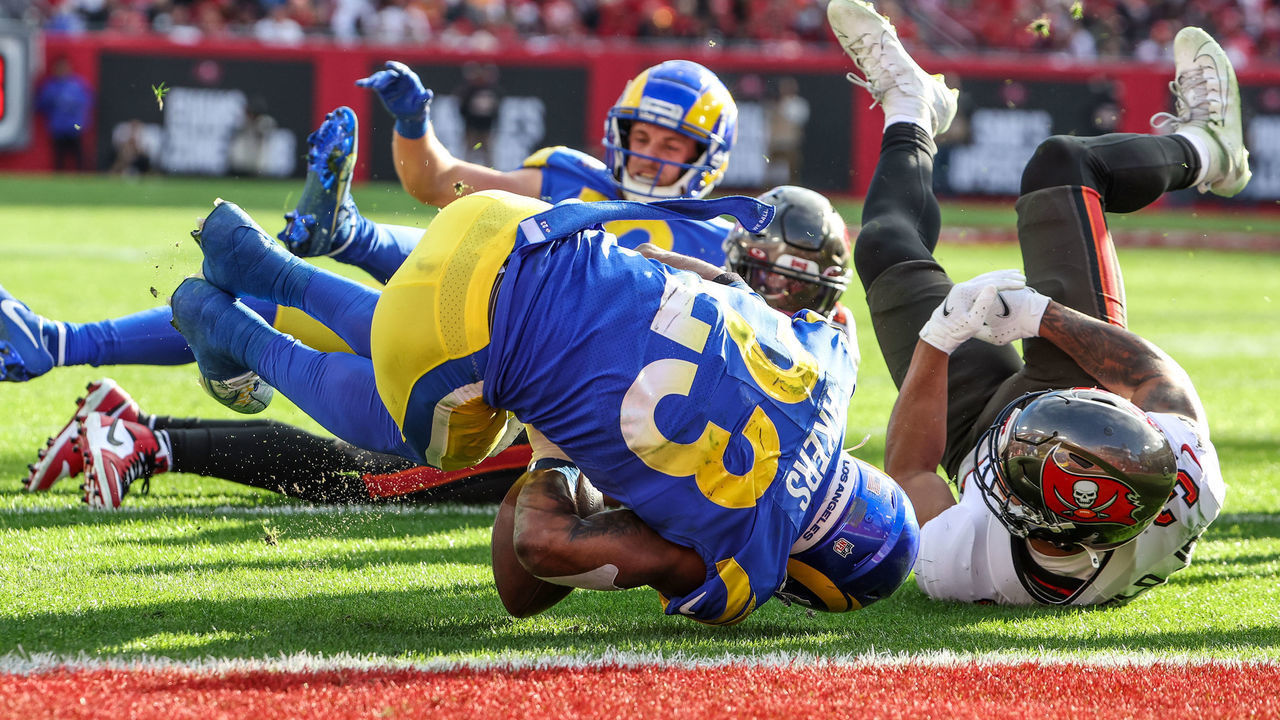Tampa, Florida, Sunday, January 23, 2022 - Los Angeles Rams running back Cam Akers (23) fumbles at the goal line as Tampa Bay Buccaneers safety Antoine Winfield Jr. (31) tackles him for a turnover in the NFC Divisional Playoff at Raymond James Stadium. (Robert Gauthier/Los Angeles Times via Getty Images)
