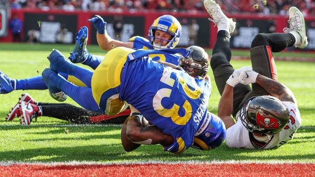 Tampa, Florida, Sunday, January 23, 2022 - Los Angeles Rams running back Cam Akers (23) fumbles at the goal line as Tampa Bay Buccaneers safety Antoine Winfield Jr. (31) tackles him for a turnover in the NFC Divisional Playoff at Raymond James Stadium. (Robert Gauthier/Los Angeles Times via Getty Images)