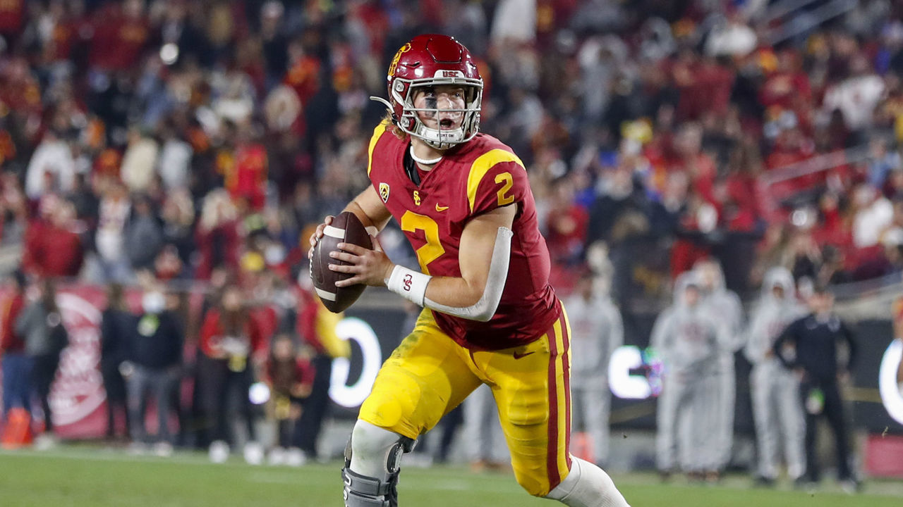 LOS ANGELES, CA - NOVEMBER 27: USC Trojans quarterback Jaxson Dart (2) runs out of the pocket during a college football game between the BYU Cougars against the USC Trojans on November 27, 2021, at United Airlines Field at The Los Angeles Memorial Coliseum in Los Angeles, CA.
