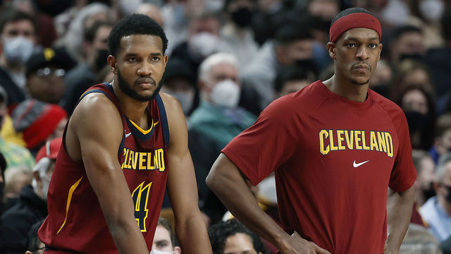 PORTLAND, OREGON - JANUARY 07: Evan Mobley # 4 and Rajon Rondo # 1 of the Cleveland Cavaliers wait to enter the game during the second half against the Portland Trail Blazers at Moda Center on January 07, 2022 in Portland, Oregon.