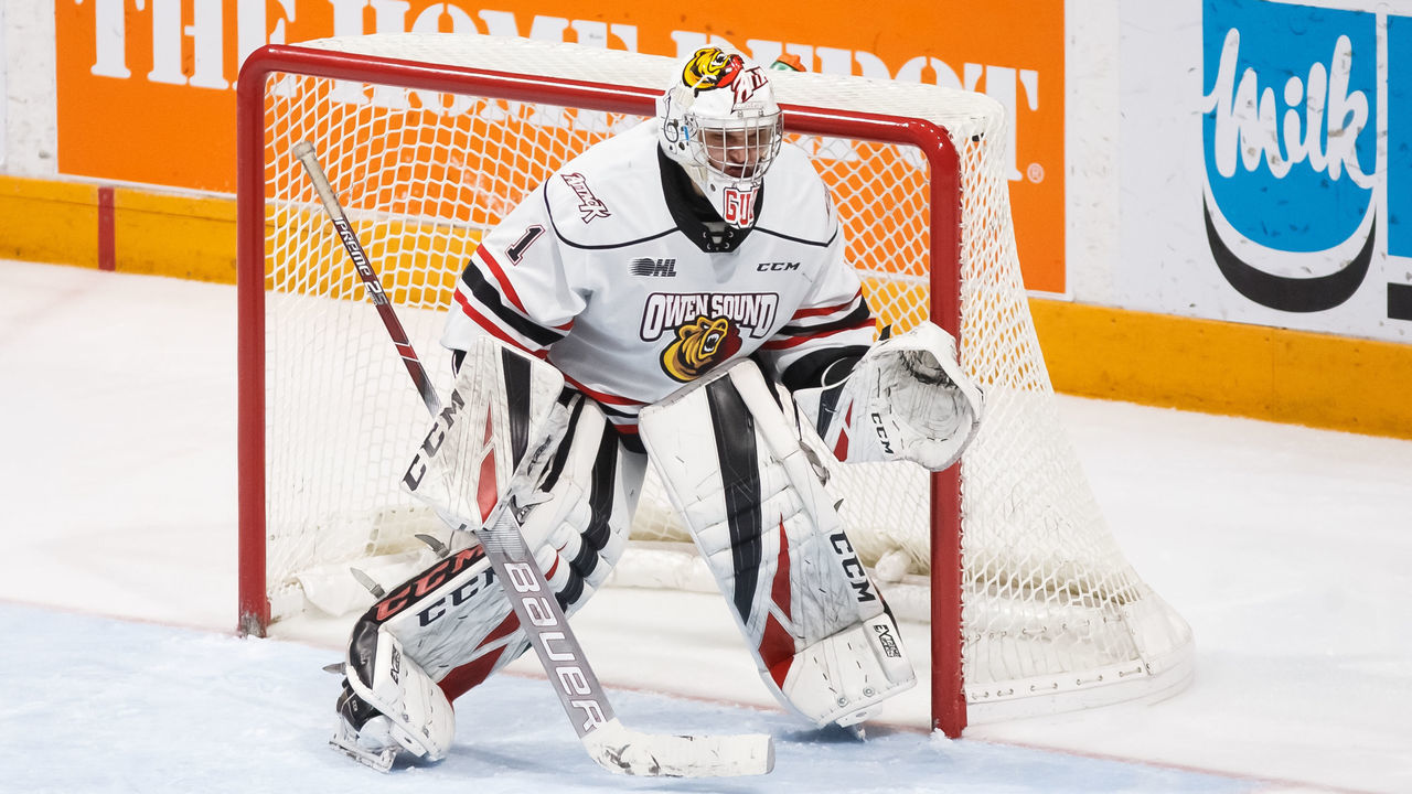 OSHAWA, ON - FEBRUARY 17: Mack Guzda #1 of the Owen Sound Attack tracks the puck during an OHL game against the Oshawa Generals at the Tribute Communities Centre on February 17, 2020 in Oshawa, Ontario, Canada.
