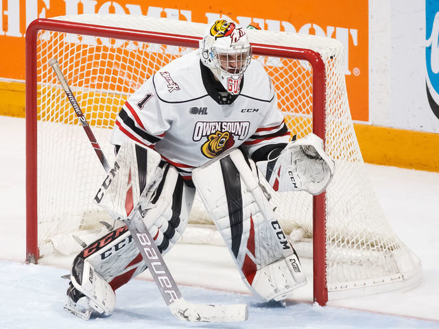 OSHAWA, ON - FEBRUARY 17: Mack Guzda #1 of the Owen Sound Attack tracks the puck during an OHL game against the Oshawa Generals at the Tribute Communities Centre on February 17, 2020 in Oshawa, Ontario, Canada.