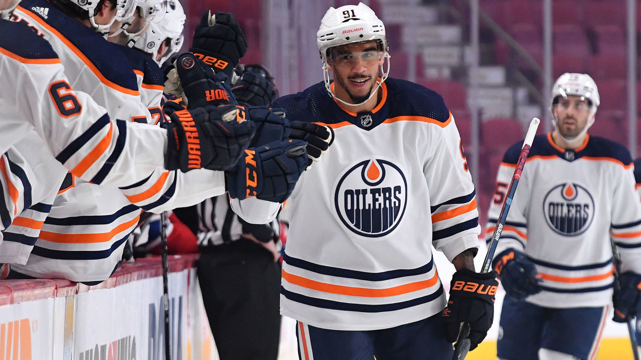 MONTREAL, QC - JANUARY 29: Evander Kane #91 of the Edmonton Oilers celebrates with the bench after scoring a goal against the Montreal Canadiens in the NHL game at the Bell Centre on January 29, 2021 in Montreal, Quebec, Canada.