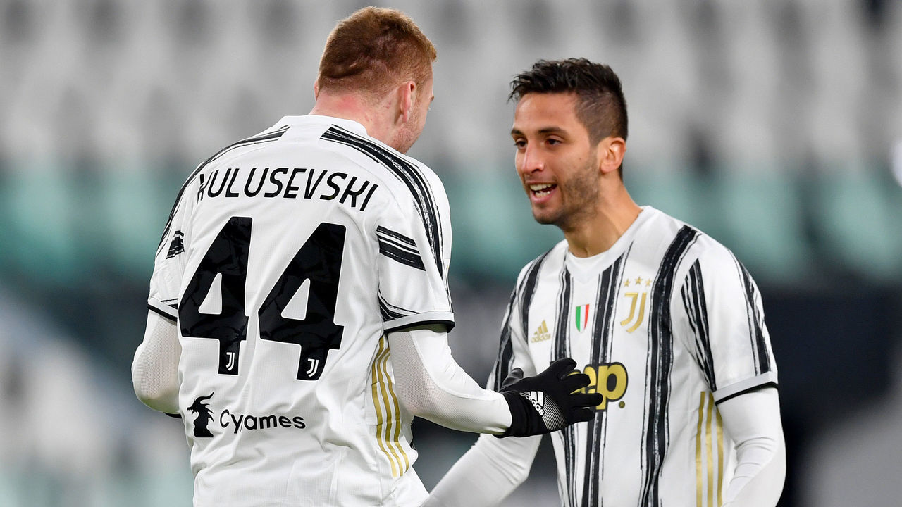 TURIN, ITALY - JANUARY 13: Dejan Kulusevski of Juventus F.C. celebrates with teammate Rodrigo Bentancur after scoring their team's first goal during the Coppa Italia match between Juventus and Genoa CFC at Allianz Stadium on January 13, 2021 in Turin, Italy. Sporting stadiums around Italy remain under strict restrictions due to the Coronavirus Pandemic as Government social distancing laws prohibit fans inside venues resulting in games being played behind closed doors.