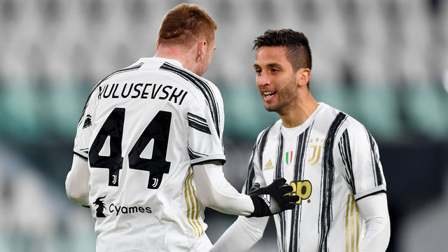 TURIN, ITALY - JANUARY 13: Dejan Kulusevski of Juventus F.C. celebrates with teammate Rodrigo Bentancur after scoring their team's first goal during the Coppa Italia match between Juventus and Genoa CFC at Allianz Stadium on January 13, 2021 in Turin, Italy. Sporting stadiums around Italy remain under strict restrictions due to the Coronavirus Pandemic as Government social distancing laws prohibit fans inside venues resulting in games being played behind closed doors.