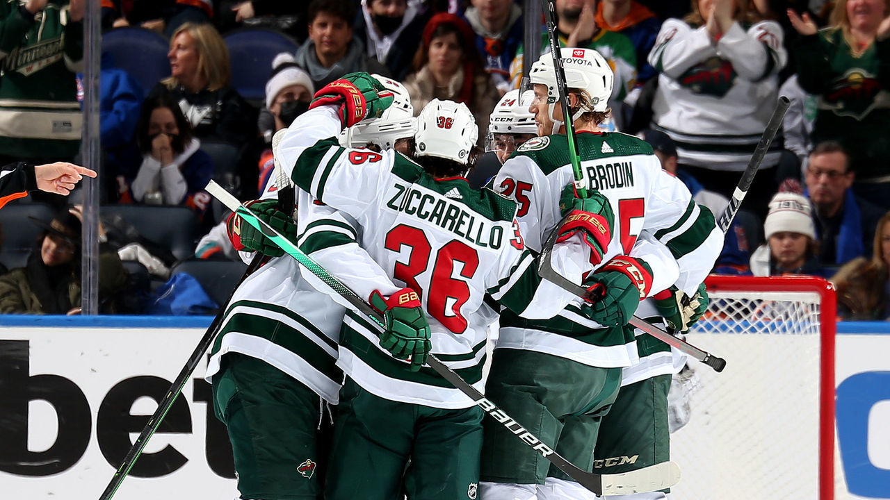ELMONT, NEW YORK - JANUARY 30: The Minnesota Wild celebrate a goal by Kirill Kaprizov #97 during the third period against the New York Islanders at UBS Arena on January 30, 2022 in Elmont, New York.