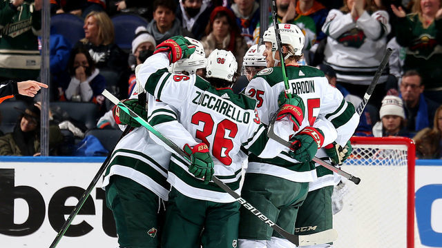 ELMONT, NEW YORK - JANUARY 30: The Minnesota Wild celebrate a goal by Kirill Kaprizov #97 during the third period against the New York Islanders at UBS Arena on January 30, 2022 in Elmont, New York.