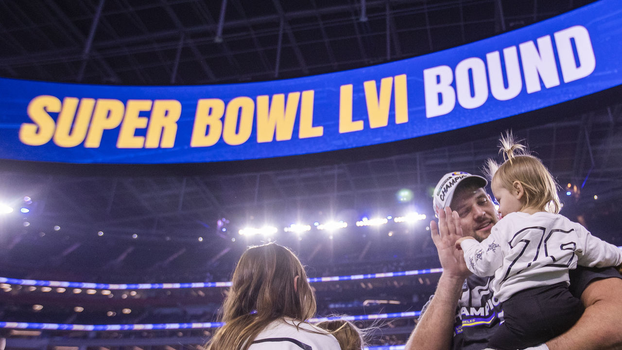 Los Angeles, CA - January 30: Rams offensive tackle Rob Havenstein gets a high-five from his daughter as he and his family celebrates their 20-17 victory over the San Francisco 49ers in the NFC Championships, winning them a berth in the Super Bowl against the Bengals at SoFi Stadium on Sunday, Jan. 30, 2022 in Los Angeles, CA. (Allen J. Schaben / Los Angeles Times via Getty Images)