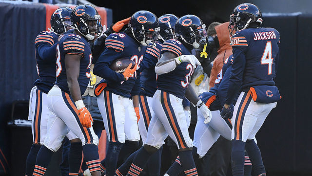 CHICAGO, ILLINOIS - JANUARY 02: Chicago Bears players celebrate after Deon Bush #26 of the Chicago Bears gets an interception in the fourth quarter of the game against the New York Giants at Soldier Field on January 02, 2022 in Chicago, Illinois.