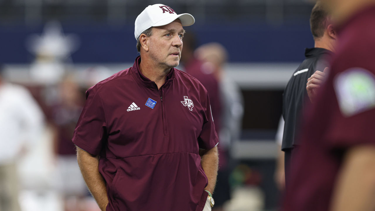 ARLINGTON, TX - SEPTEMBER 25: Texas A&M coach Jimbo Fisher watches his team warm up before the Southwest Classic between the Arkansas Razorbacks and the Texas A&M Aggies on September 25, 2021, at AT&T Stadium in Arlington, TX.