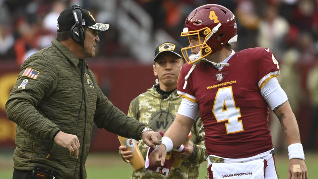 LANDOVER, MD - NOVEMBER 14: Washington Football Team head coach Ron Rivera talk with Washington Football Team quarterback Taylor Heinicke (4) before the fourth quarter touchdown play during the game between the Washington Football Team and the Tampa Bay Buccaneers at FedEx Field on Sunday, November 14, 2021.