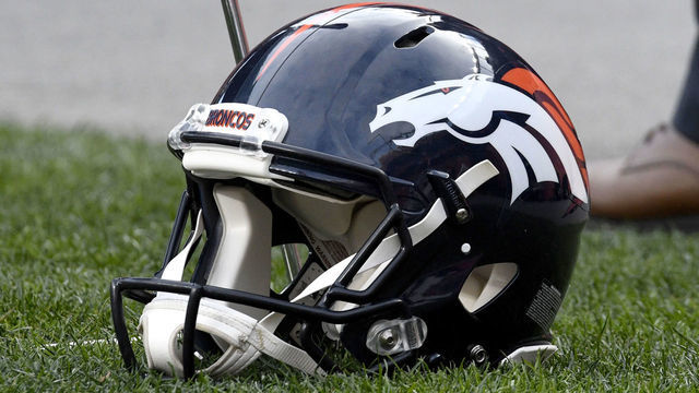 DENVER, CO - NOVEMBER 28: A Denver Broncos helmet sits on the sideline during the NFL game between the Los Angeles Chargers and the Denver Broncos on November 28, 2021, at Empower Field at Mile High in Denver, Colorado.