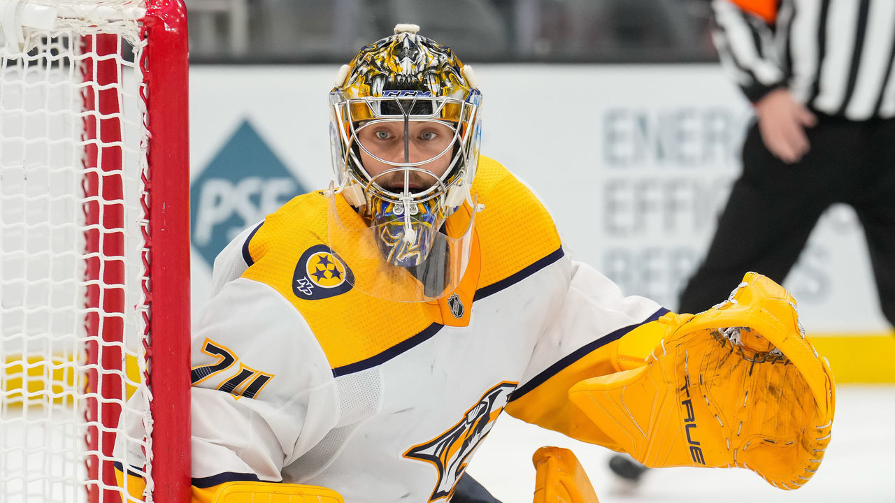 SEATTLE, WASHINGTON - JANUARY 25: Juuse Saros #74 of the Nashville Predators eyes the puck during the third period against the Seattle Kraken at Climate Pledge Arena on January 25, 2022 in Seattle, Washington.