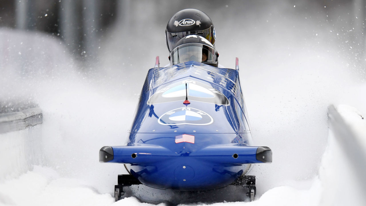 24 January 2021, Bavaria, Schönau Am Königssee: Bobsleigh: World Cup, two-man bobsleigh, women. The us bobsledders Elana Meyers Taylor and Sylvia Hoffman cross the finish line on the artificial ice track at Königssee. Meyers Taylor and Hoffman finished in third place. Photo: Tobias Hase/dpa