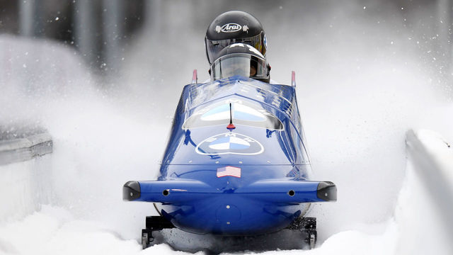24 January 2021, Bavaria, Schönau Am Königssee: Bobsleigh: World Cup, two-man bobsleigh, women. The us bobsledders Elana Meyers Taylor and Sylvia Hoffman cross the finish line on the artificial ice track at Königssee. Meyers Taylor and Hoffman finished in third place. Photo: Tobias Hase/dpa