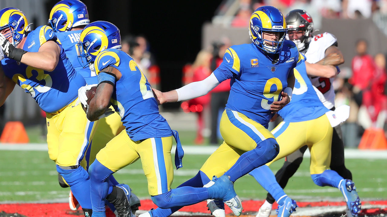 TAMPA, FL - JANUARY 23: Los Angeles Rams Quarterback Matthew Stafford (9) hands the ball off to Running Back Running Back Cam Akers (23) during the NFC Divisional game between the Los Angeles Rams and the Tampa Bay Buccaneers on January 23, 2022 at Raymond James Stadium in Tampa, Florida.