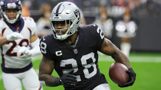 LAS VEGAS, NEVADA - DECEMBER 26: Josh Jacobs #28 of the Las Vegas Raiders runs with the ball against the Denver Broncos in the first quarter at Allegiant Stadium on December 26, 2021 in Las Vegas, Nevada.