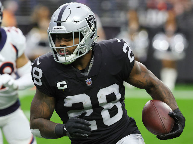 LAS VEGAS, NEVADA - DECEMBER 26: Josh Jacobs #28 of the Las Vegas Raiders runs with the ball against the Denver Broncos in the first quarter at Allegiant Stadium on December 26, 2021 in Las Vegas, Nevada.
