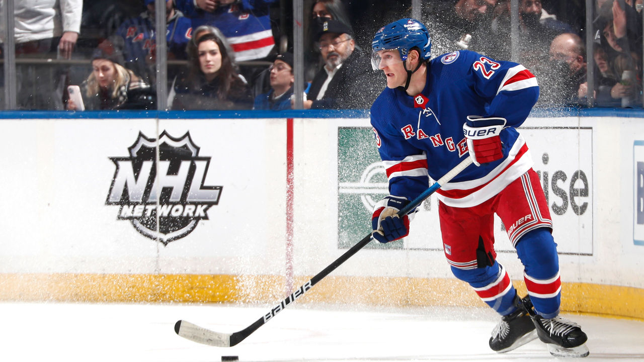 NEW YORK, NY - JANUARY 24: Adam Fox #23 of the New York Rangers skates with the puck against the Los Angeles Kings at Madison Square Garden on January 24, 2022 in New York City.