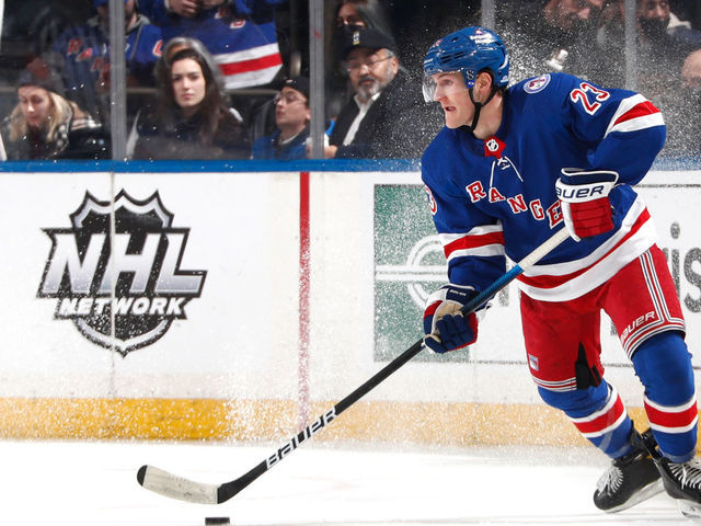 NEW YORK, NY - JANUARY 24: Adam Fox #23 of the New York Rangers skates with the puck against the Los Angeles Kings at Madison Square Garden on January 24, 2022 in New York City.